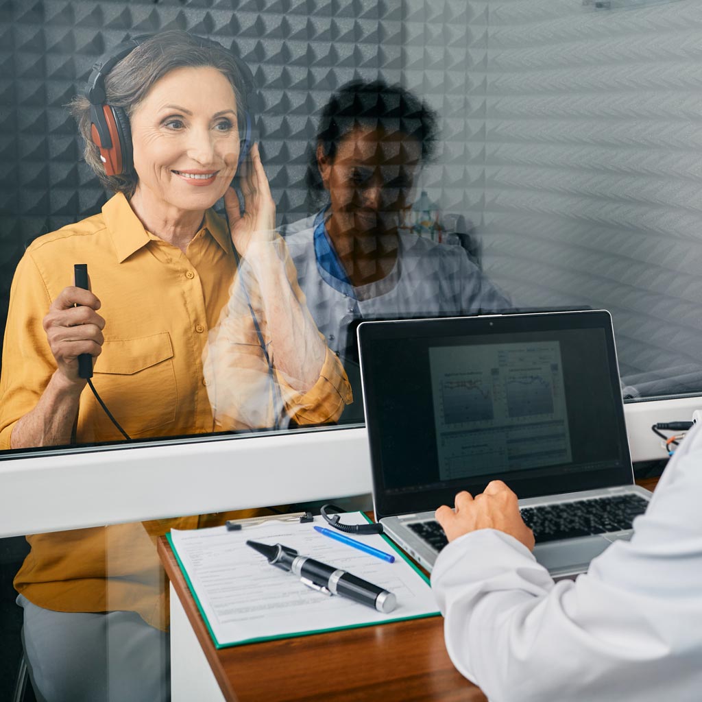 network hearing hearing tests hero woman smiling getting hearing test